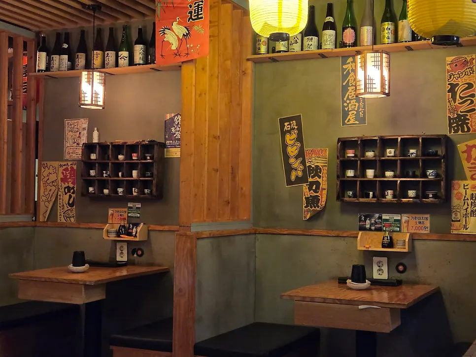 Interior decorated with posters, lanterns, and small props