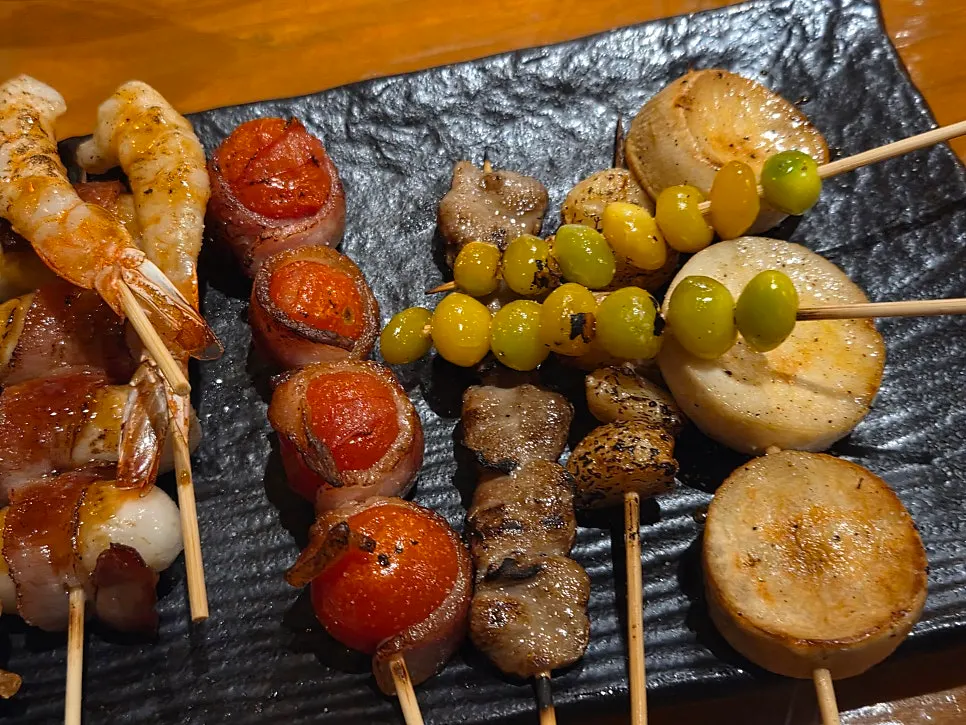 Close-up of skewers picked one by one