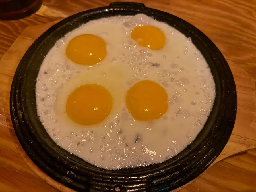 Fried egg served as a complimentary side dish