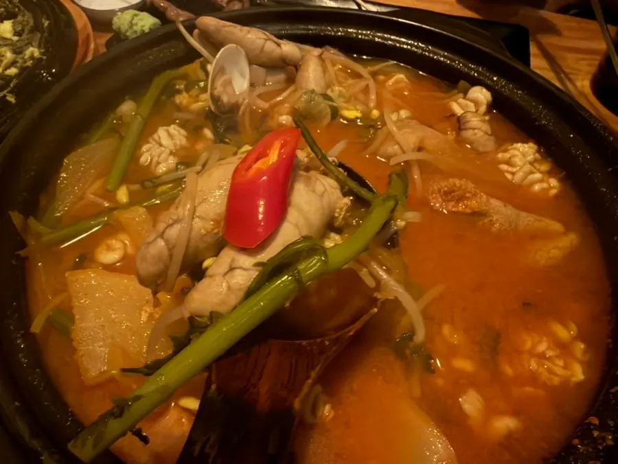 A pot of altang (pollock roe soup) bubbling on the table