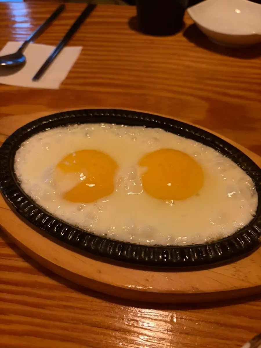 Complimentary soft-yolk fried egg