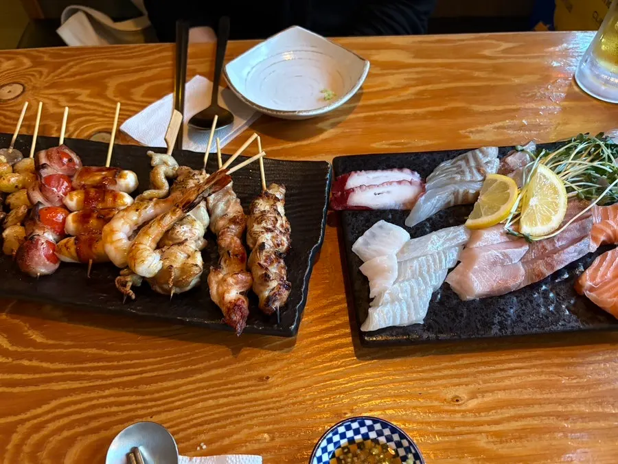 Table with sashimi and skewers together