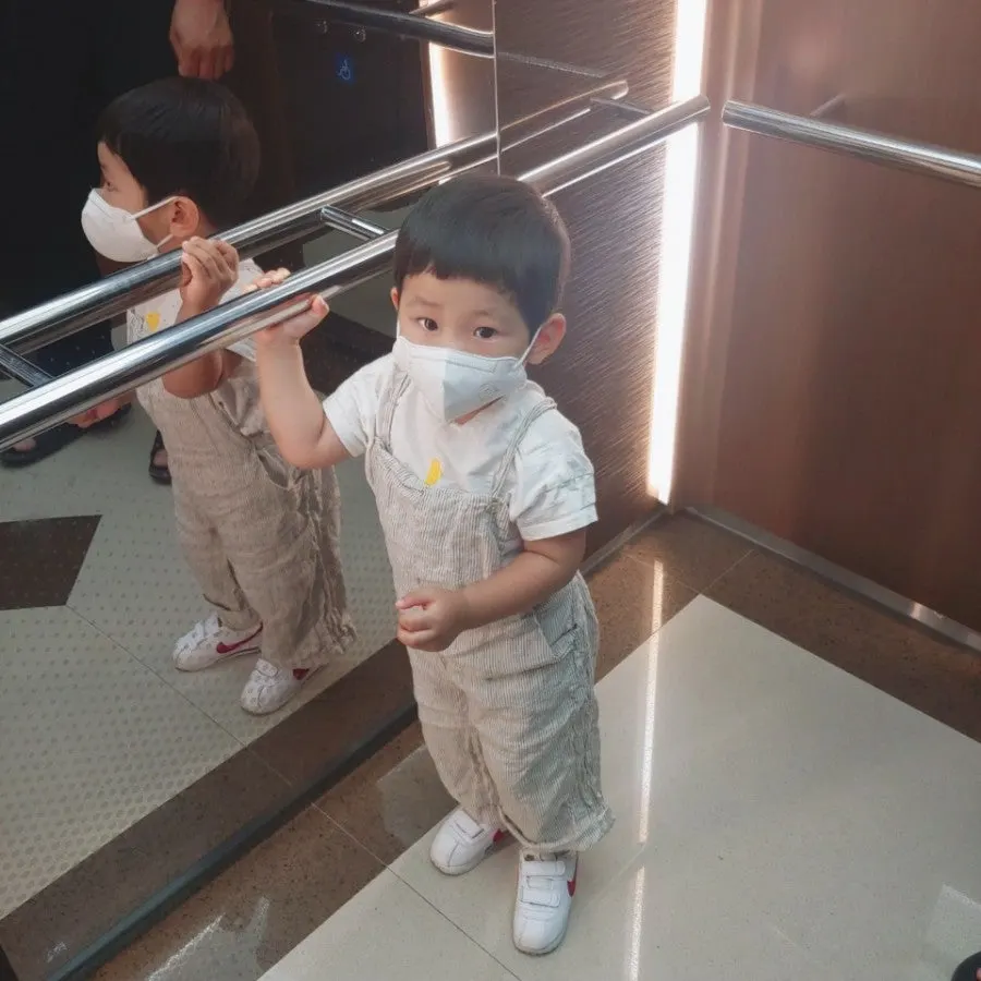 Baby wearing linen overalls