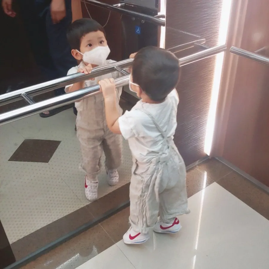 Baby overalls worn in a roomy fit