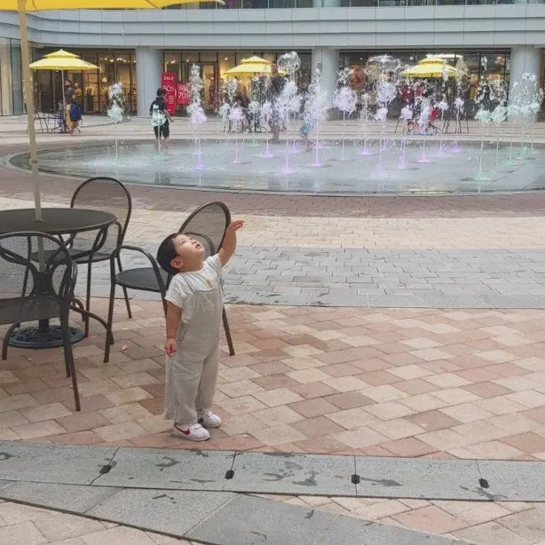 Baby wearing overalls with a T-shirt