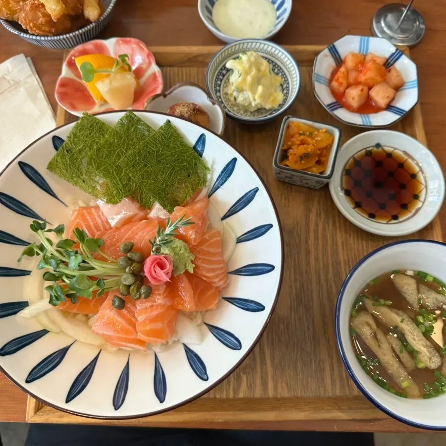 Herb-aged salmon rice bowl topped with thick salmon