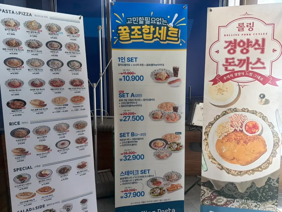 Rolling Pasta menu board posted outside the store
