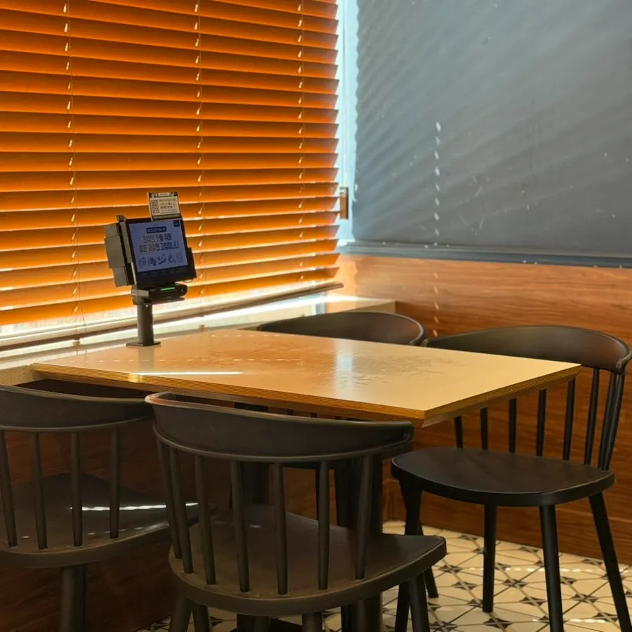 Interior of Rolling Pasta Suwon Station Branch with wood-tone decor