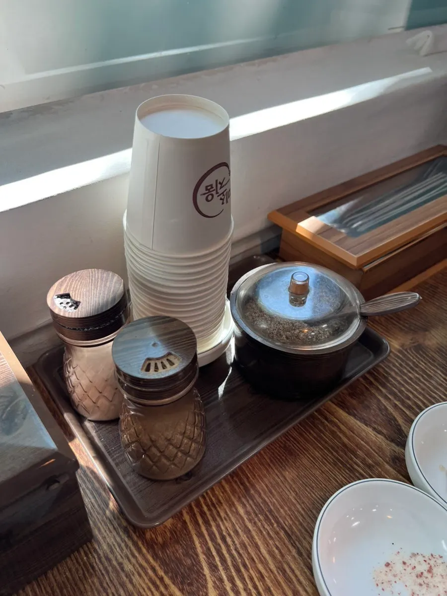 Perilla seed powder, salt, and pepper on the table