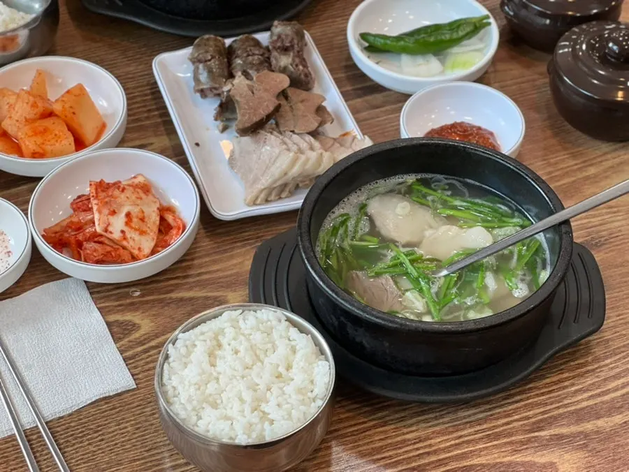 First spoonful of the clear pork soup broth