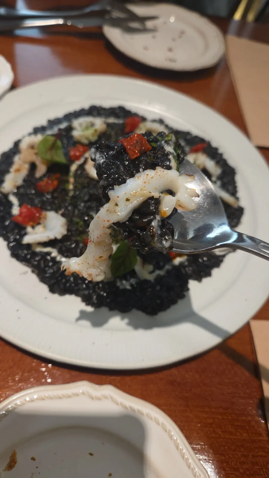 Grilled squid atop the ink risotto