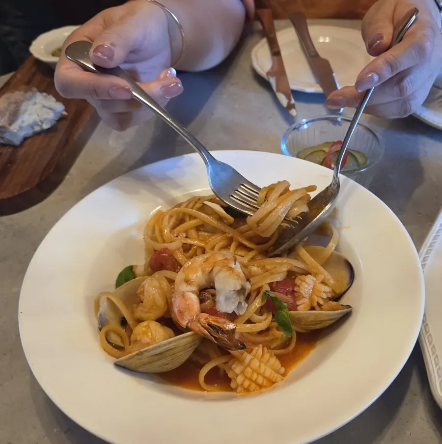 Plating pasta tomato seafood