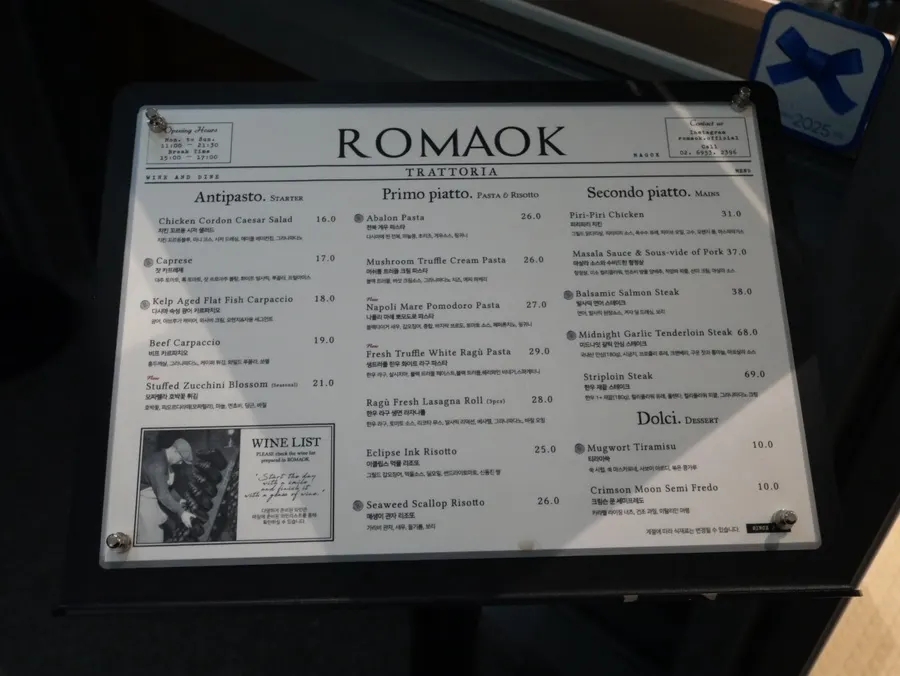 Romaok Magok menu board featuring pasta, risotto, and steak
