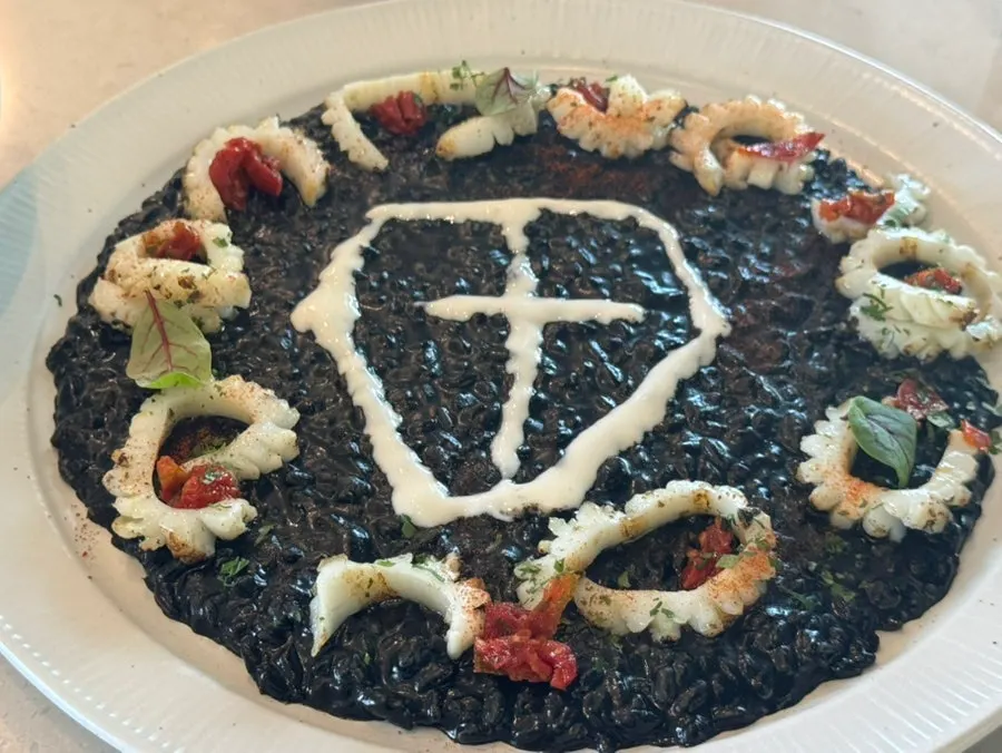 Cooked abalone on top of the pasta