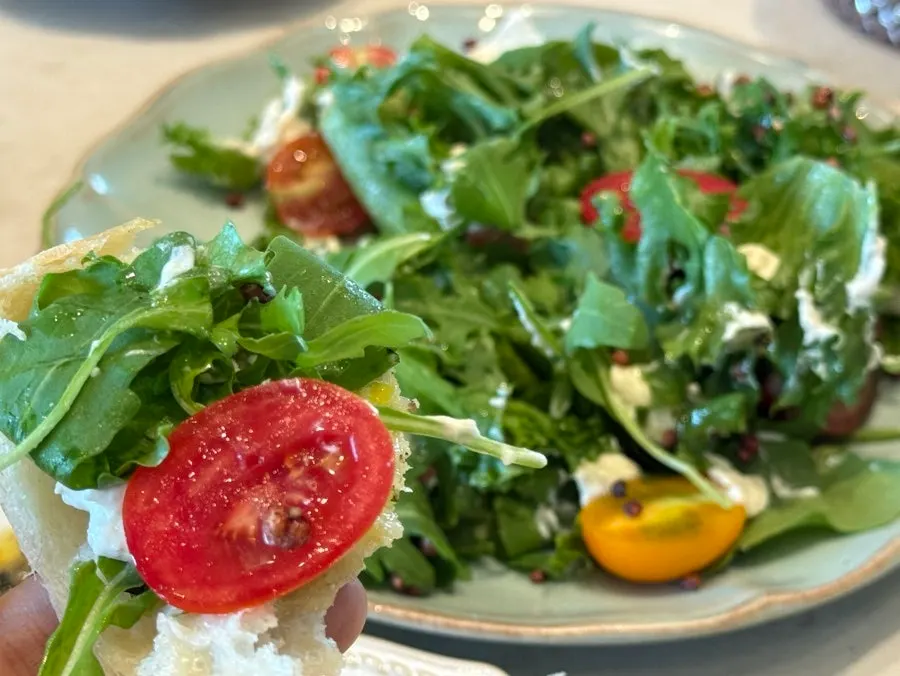 Pine nut caprese with cheese, tomato and arugula