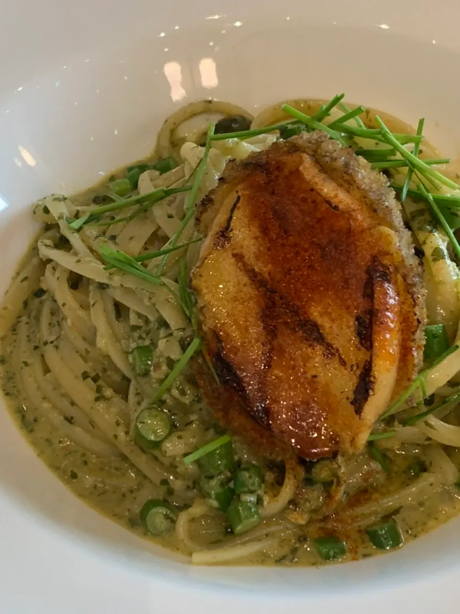 Gaewoo pasta topped with a large piece of abalone