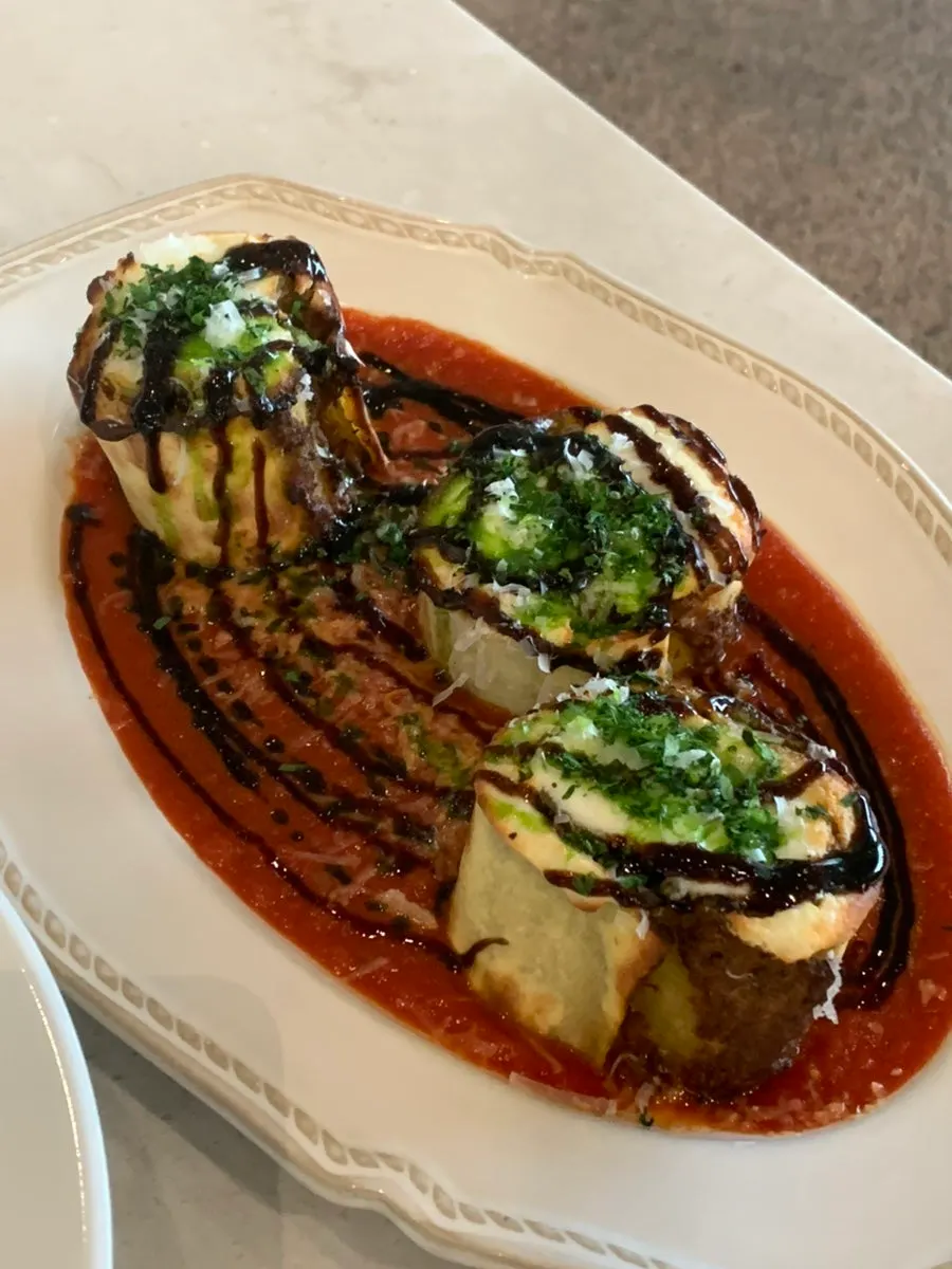 Plating of the beef ragu fresh lasagna roll