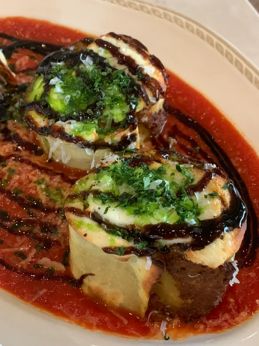 Lasagna rolled up into a roll shape