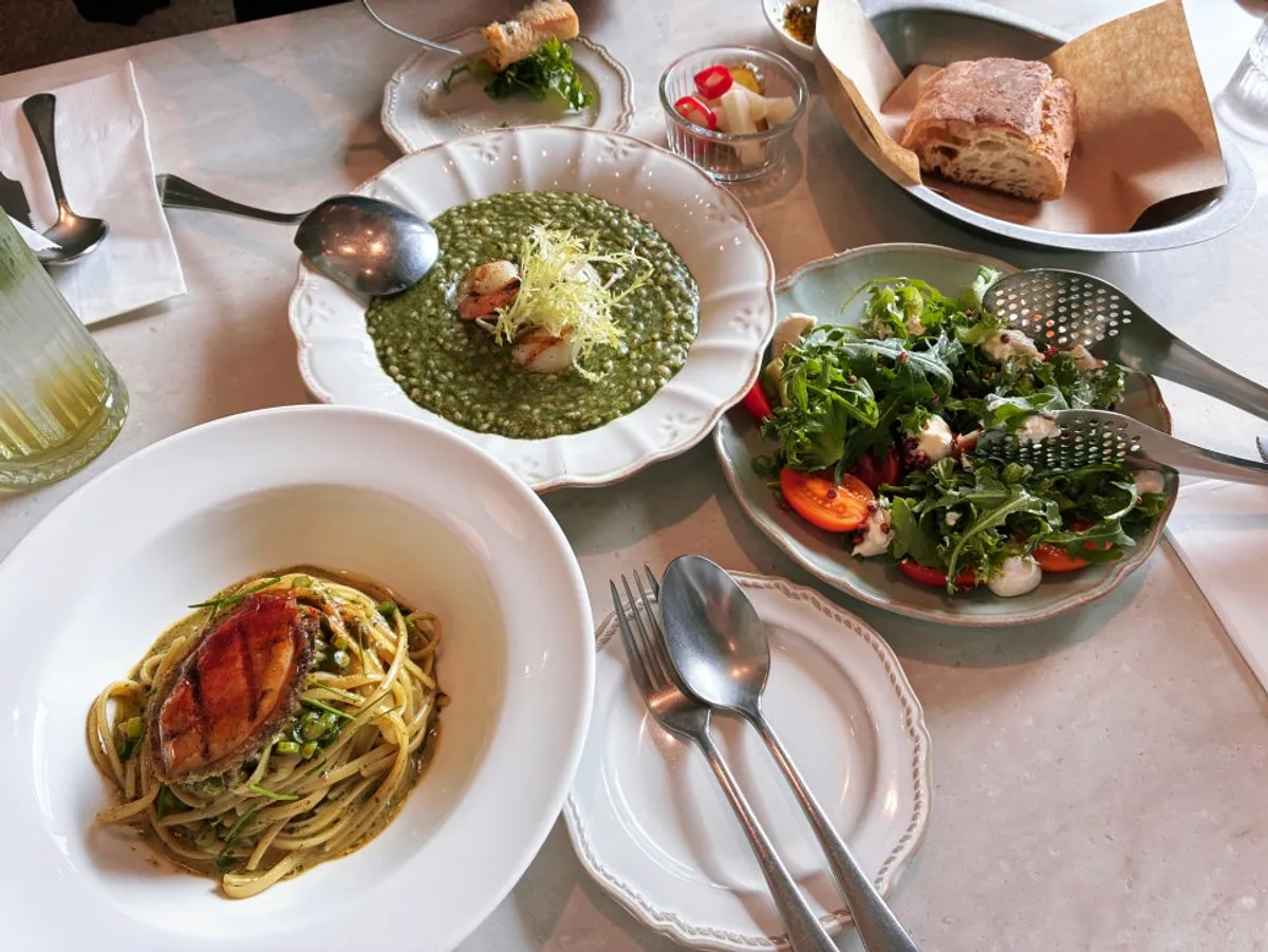 Pasta and risotto laid out on the table at Romaok Magok