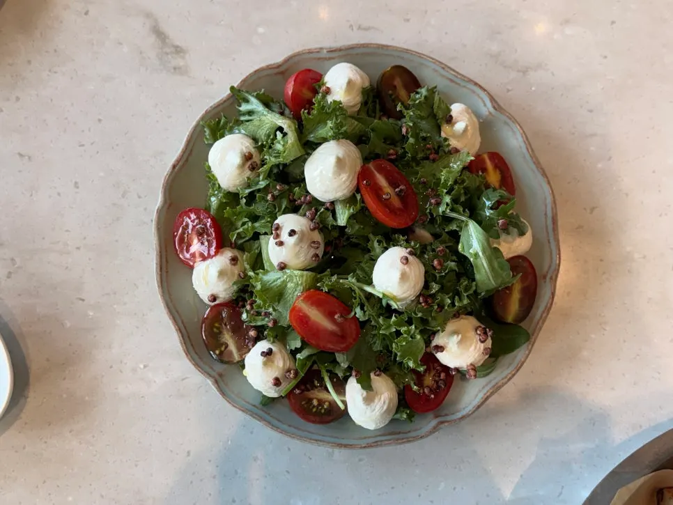 Plated pine nut caprese salad at Romaok Magok