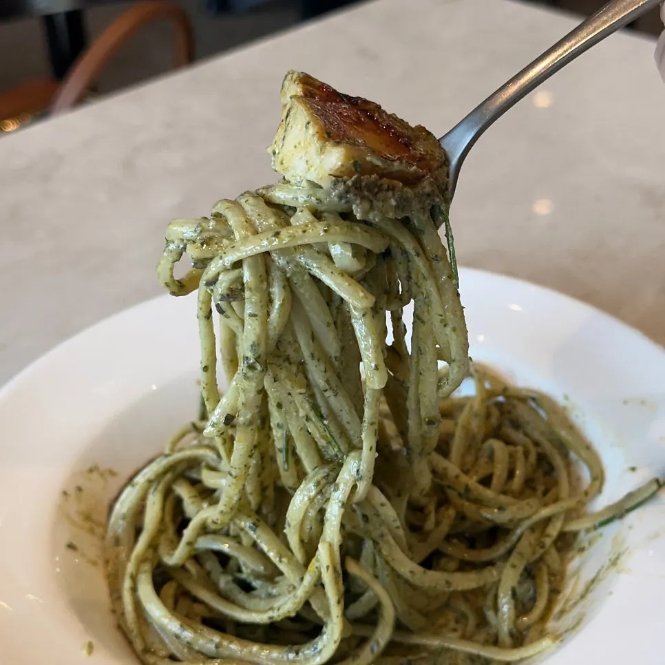 Close-up of geou pasta showing abalone and linguine