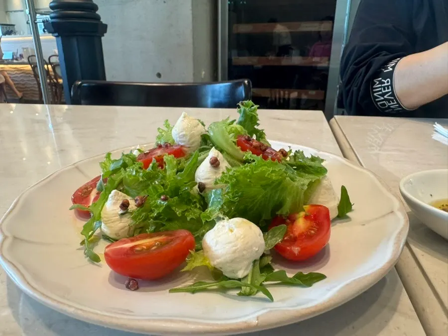 Complimentary pine nut caprese salad