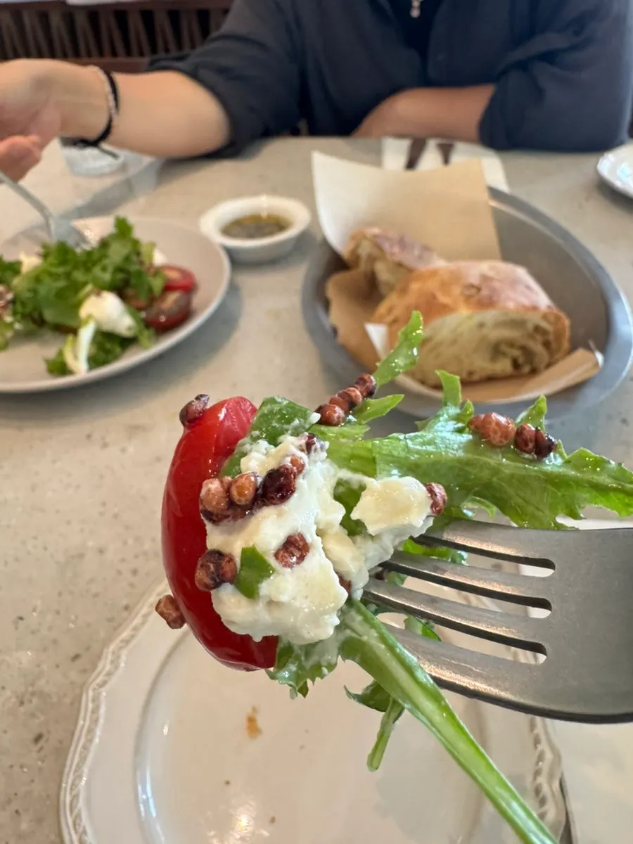 Caprese salad with ricotta cheese, arugula, and tomato