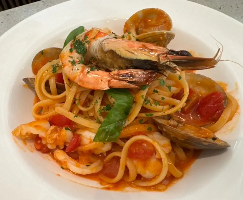 Napoli Mare pomodoro pasta topped with shrimp