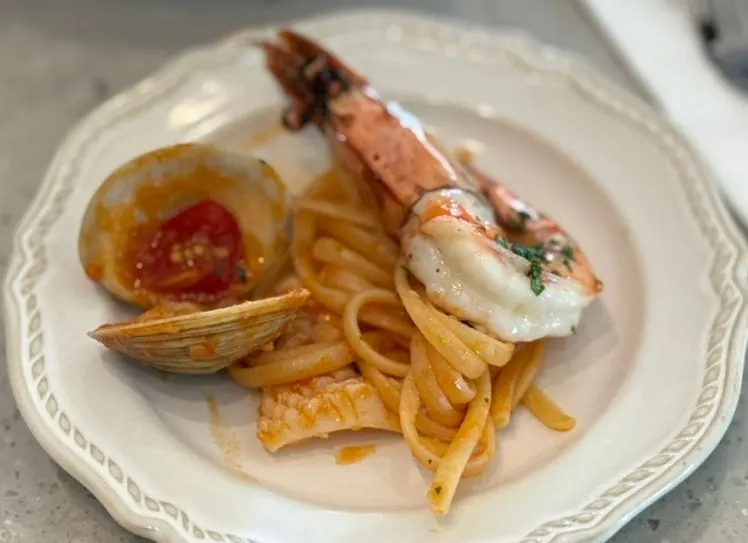 Seafood tomato pasta with noodles set aside