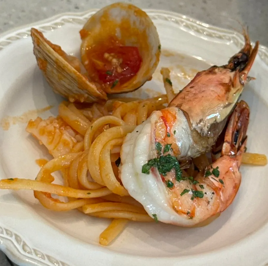 Close-up of shrimp and noodles plated together