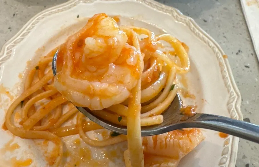 Pasta showing shrimp with score cuts