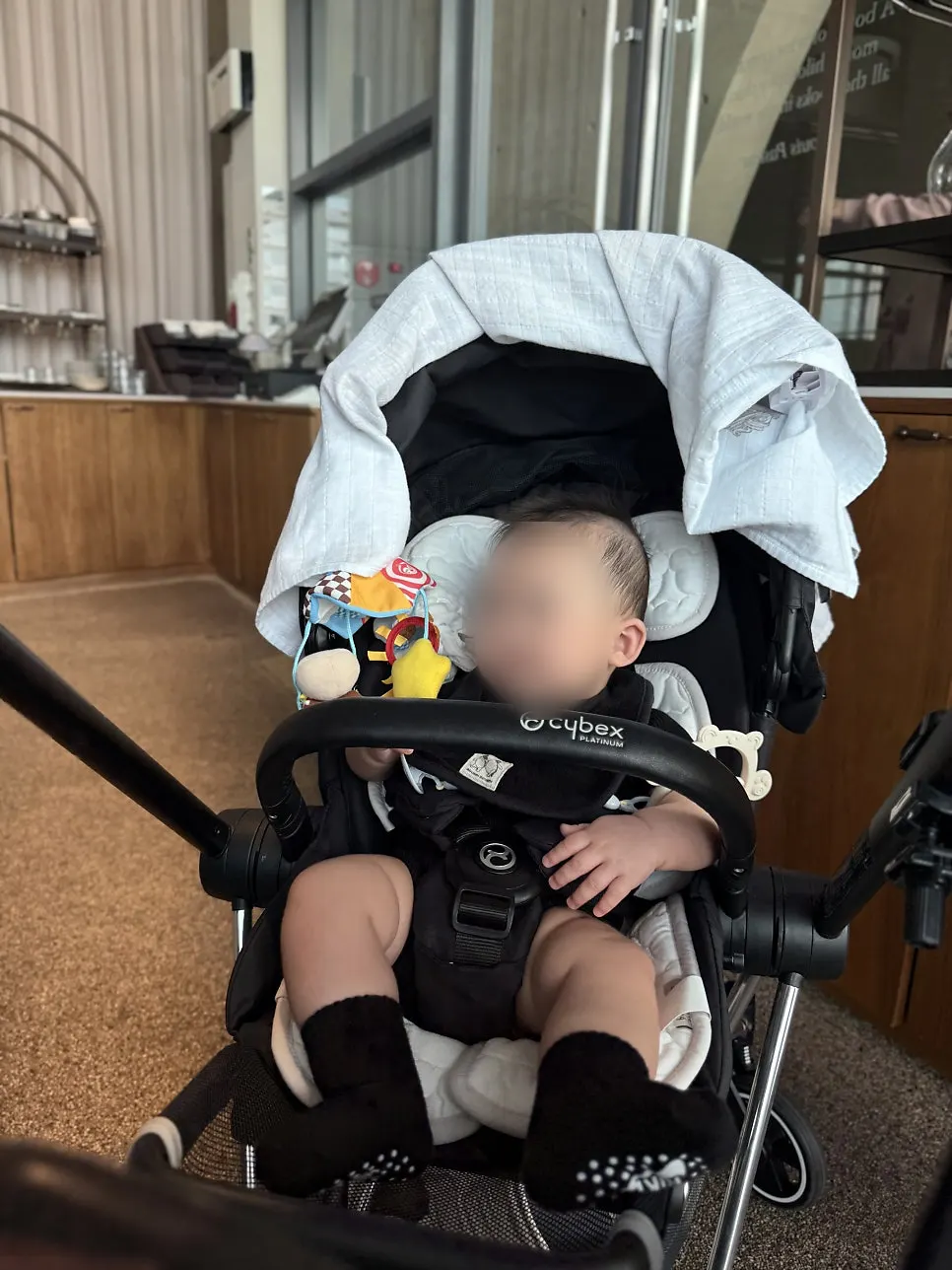 Pre-birthday baby out and about in a stroller