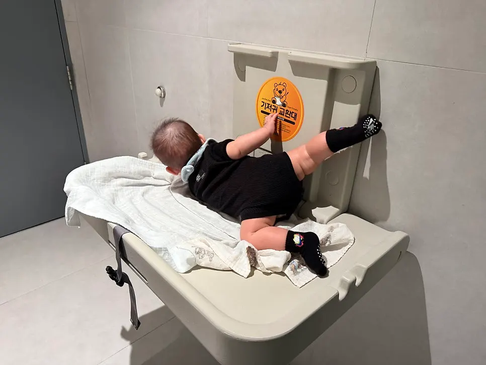 Diaper changing table inside an LG Art Center restroom