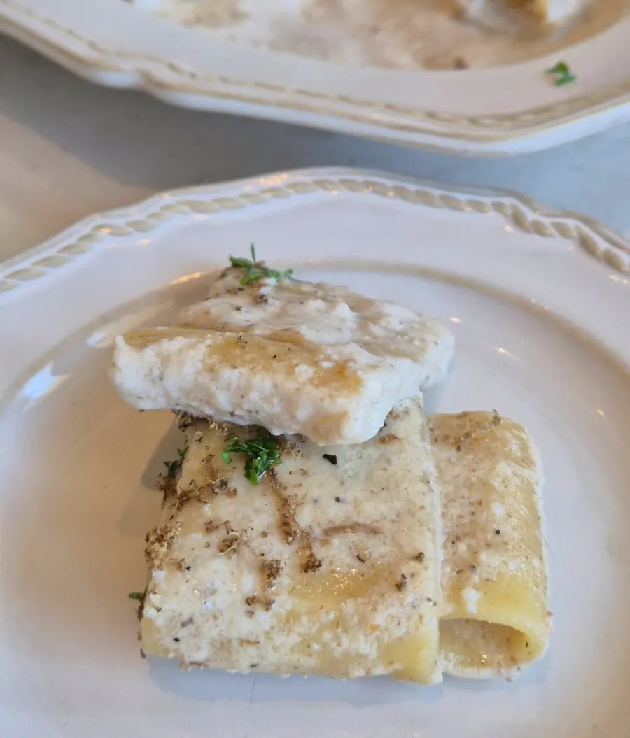 Pasta topped with grated fresh black truffle