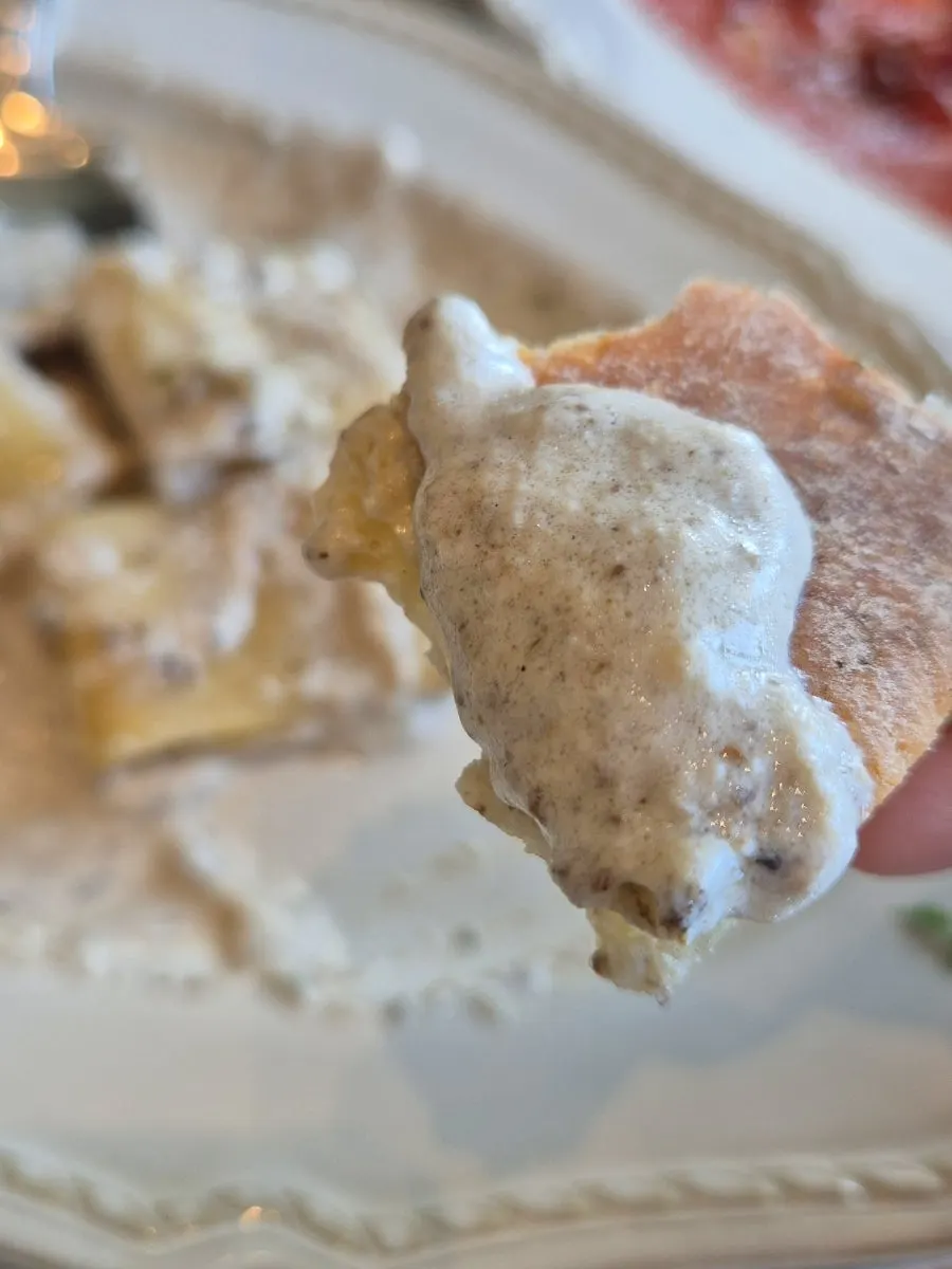 Pre-meal bread dipped in pasta sauce