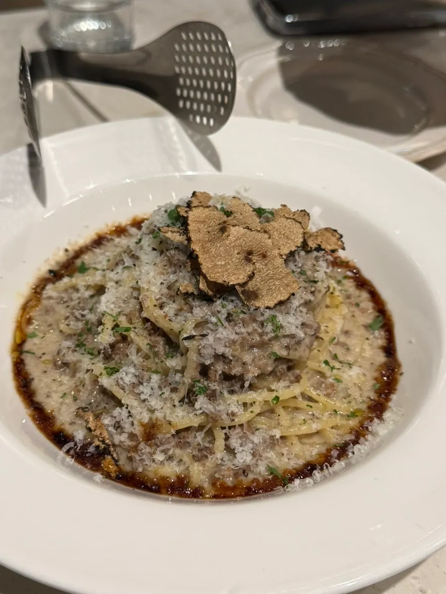 Hanwoo white ragu pasta topped with fresh truffle slices