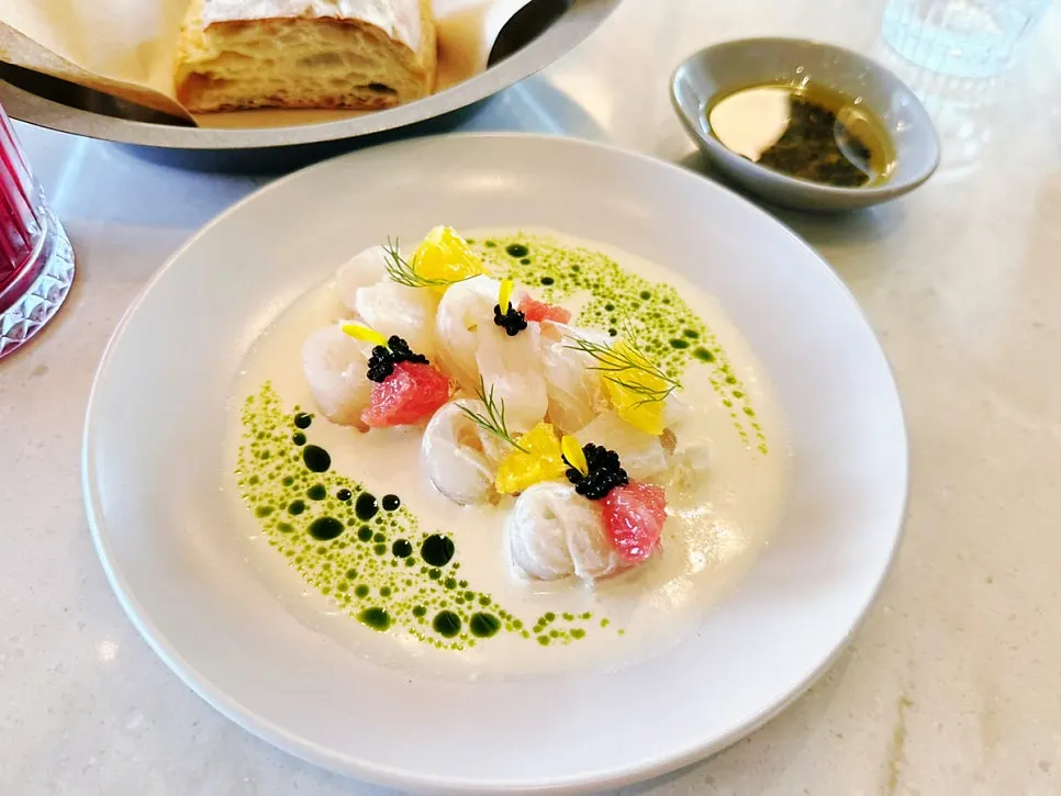 Kelp-aged flounder carpaccio served over wasabi cream