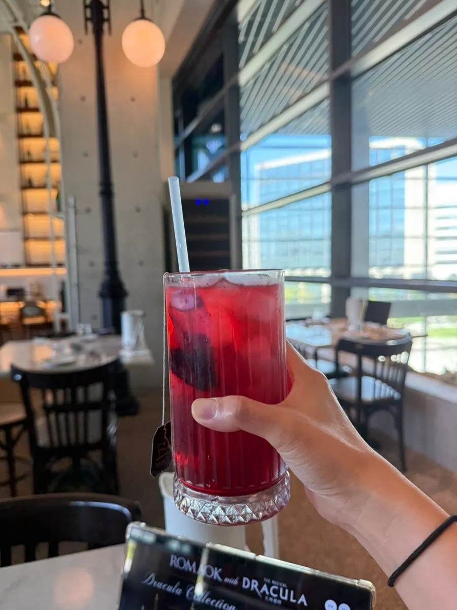 A glass of iced hibiscus packed with ice