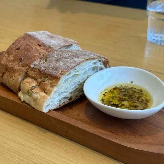 House-baked green onion focaccia served before the meal