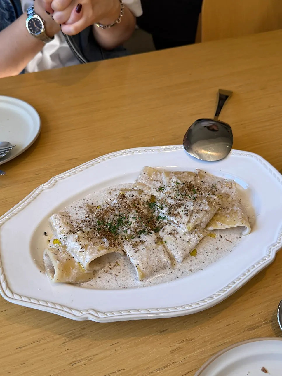 Rich mushroom cream sauce coating the mezze paccheri noodles