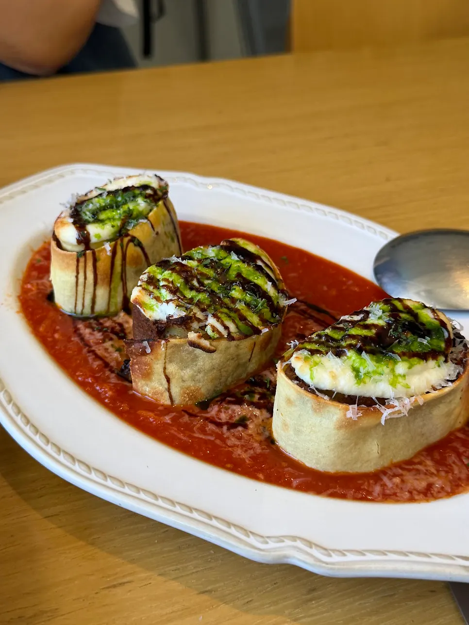 Plated Korean beef ragu fresh pasta lasagna roll