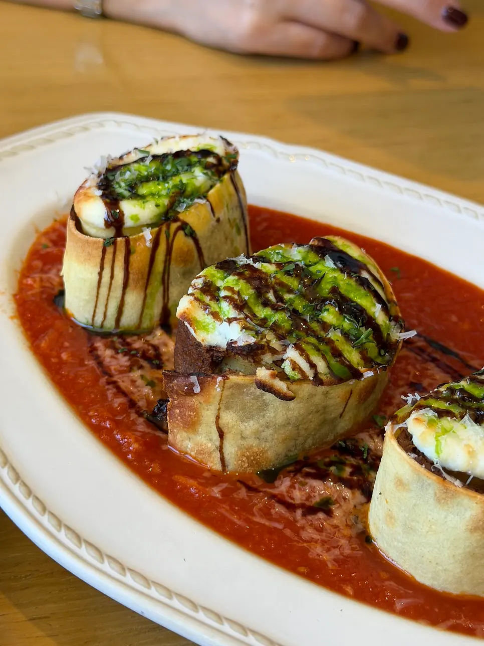 Cross-section of the lasagna roll showing ricotta mousse and ragu