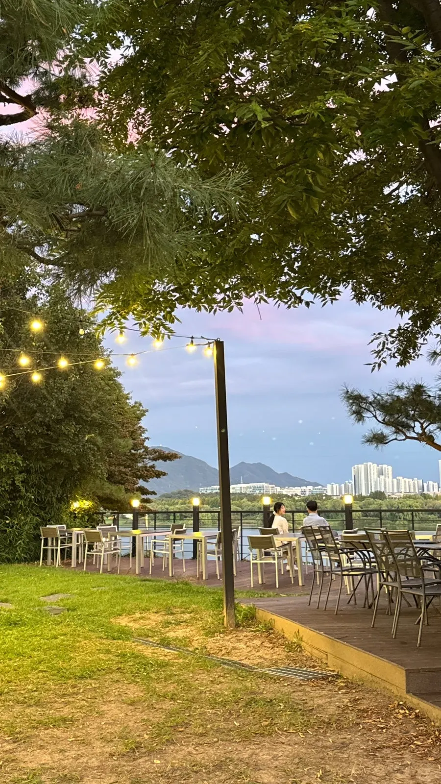 Wide grassy yard with a view of the Han River
