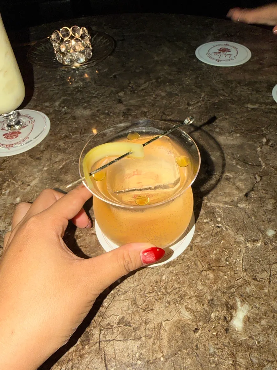 Water Lily Pond cocktail topped with herb oil