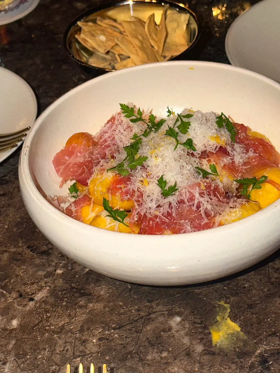 Butter-roasted baby potatoes topped with jamón and cheese
