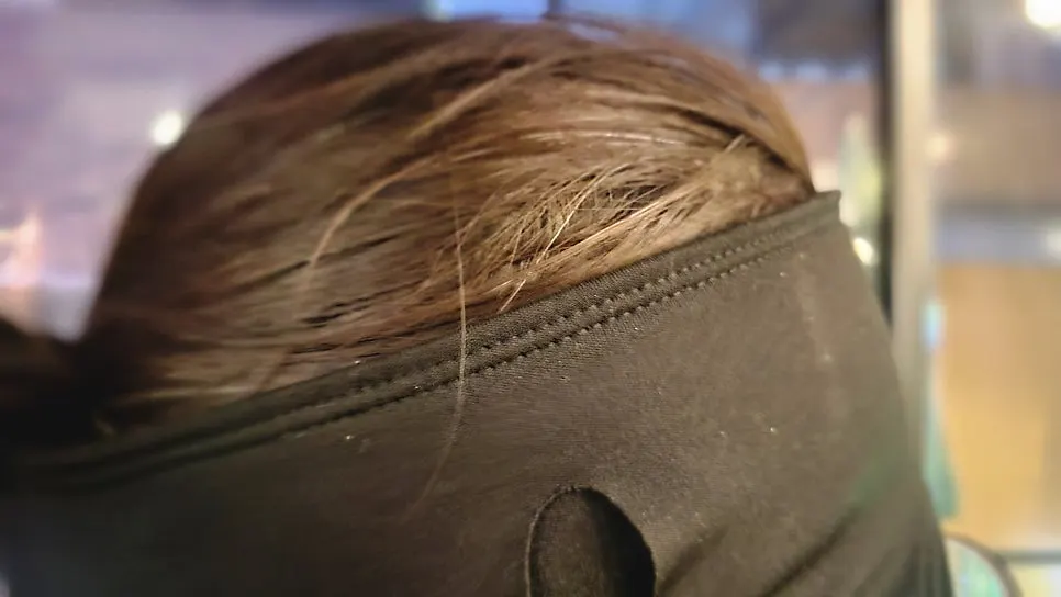 Ear warmers worn to block cold wind