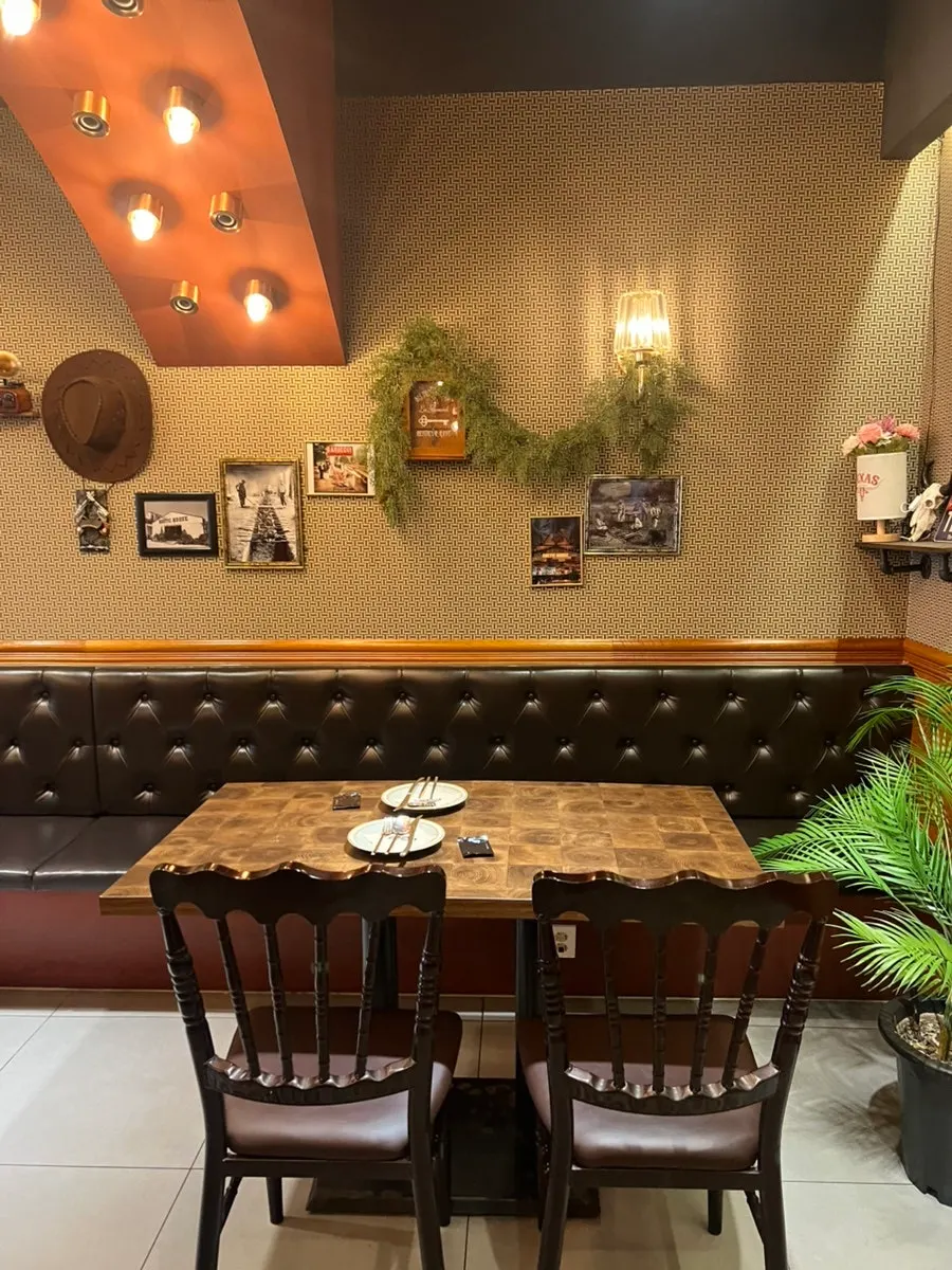 Interior decorated with wood tones and framed props