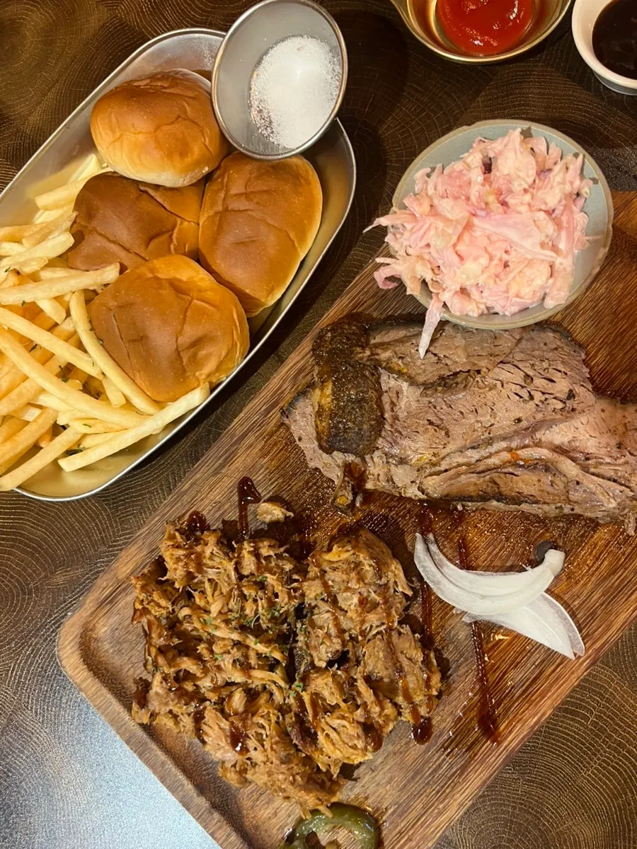 Pulled pork and brisket served with french fries