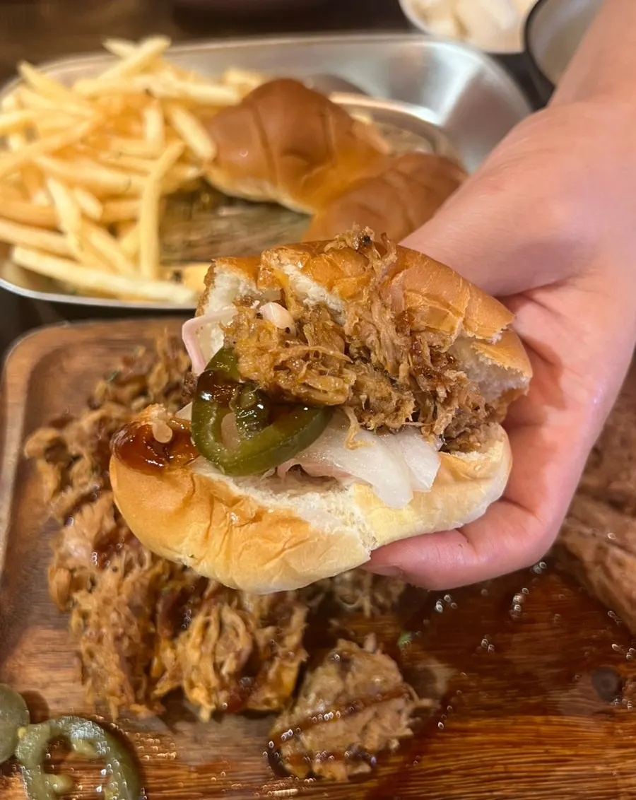 Dinner roll sandwich stuffed with meat and jalapeños