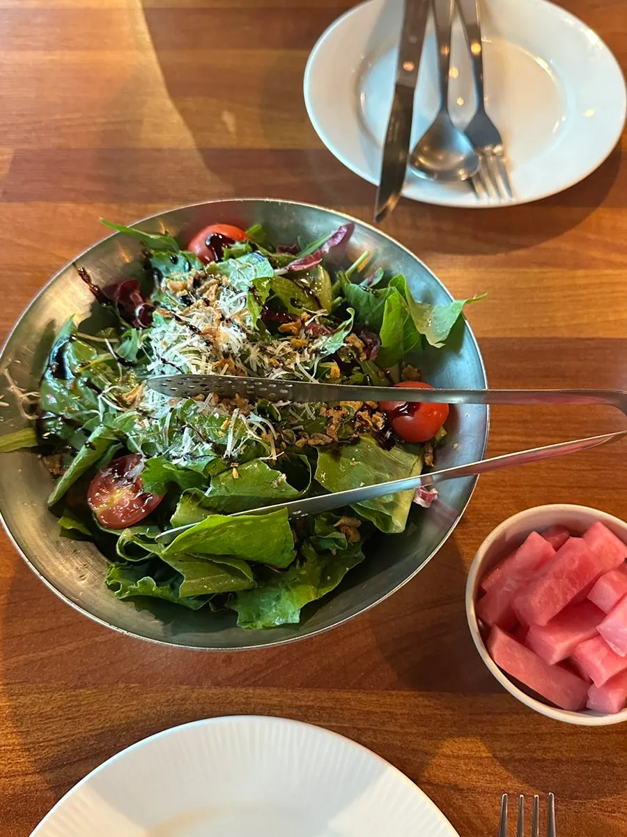 Salad drizzled with balsamic sauce